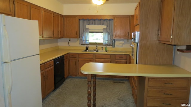 kitchen featuring oven, white refrigerator, sink, kitchen peninsula, and black dishwasher