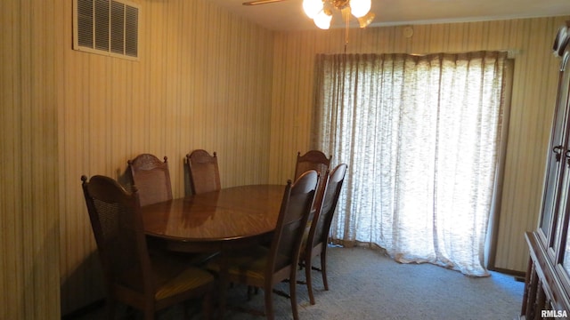 dining room featuring ceiling fan and carpet flooring