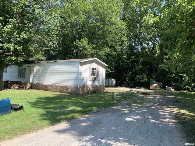 exterior space with a yard and driveway