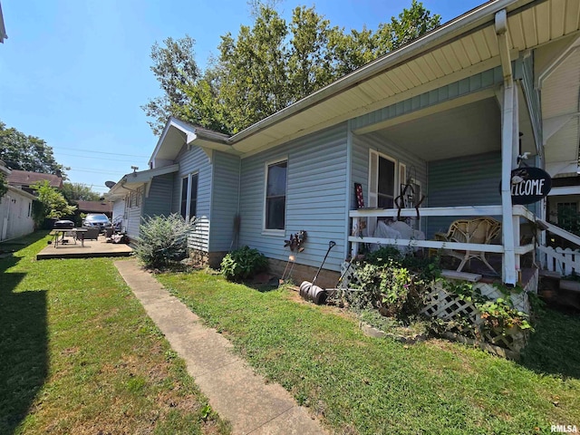 view of property exterior featuring a lawn