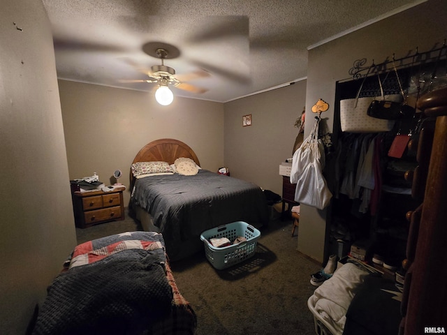 carpeted bedroom featuring a textured ceiling and ceiling fan