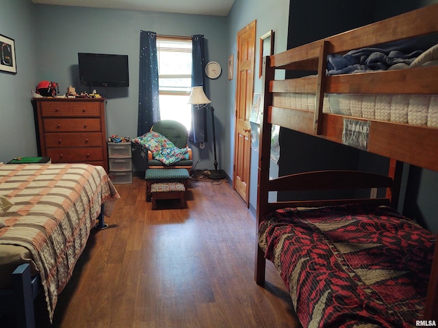 bedroom featuring wood finished floors