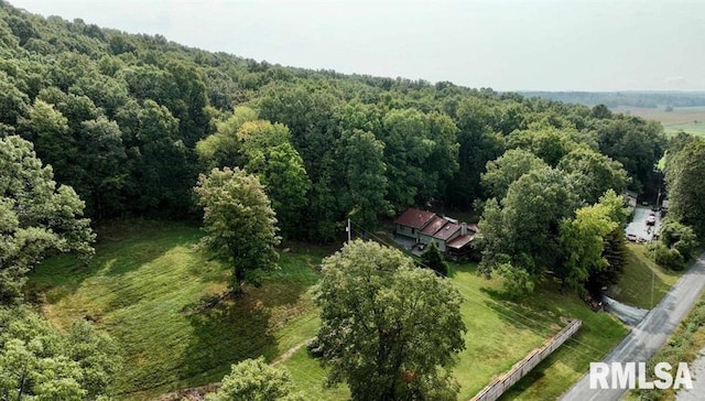 bird's eye view featuring a forest view