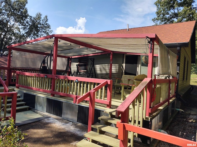 rear view of house with a deck