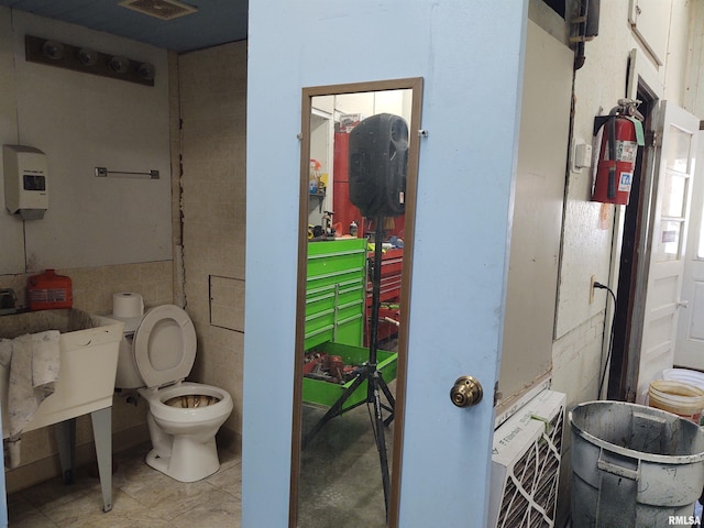 bathroom with visible vents and toilet