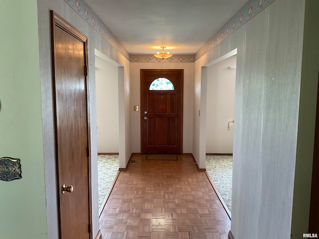 doorway with parquet flooring