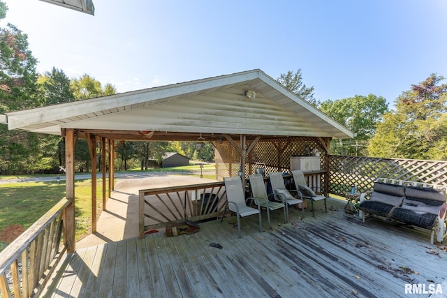 wooden terrace with a gazebo and a yard