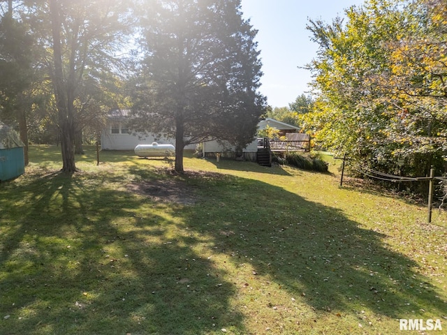 view of yard with a deck