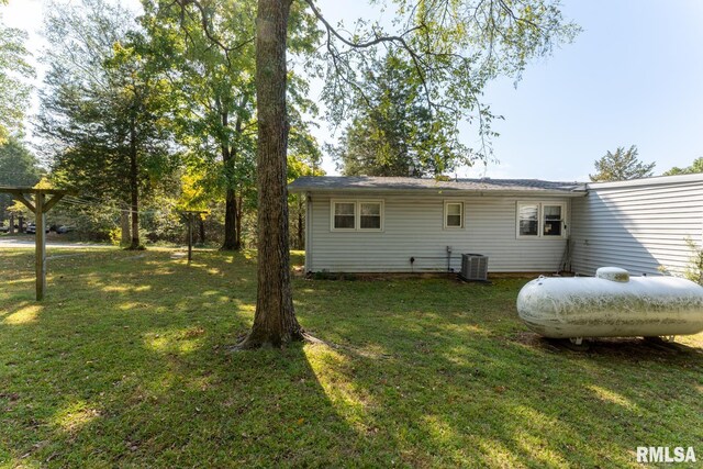25 Lees Dr, Creal Springs, IL 62922 - back of property featuring central air condition unit and a lawn