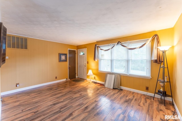 25 Lees Dr, Creal Springs, IL 62922 - unfurnished living room featuring wood finished floors, visible vents, and baseboards