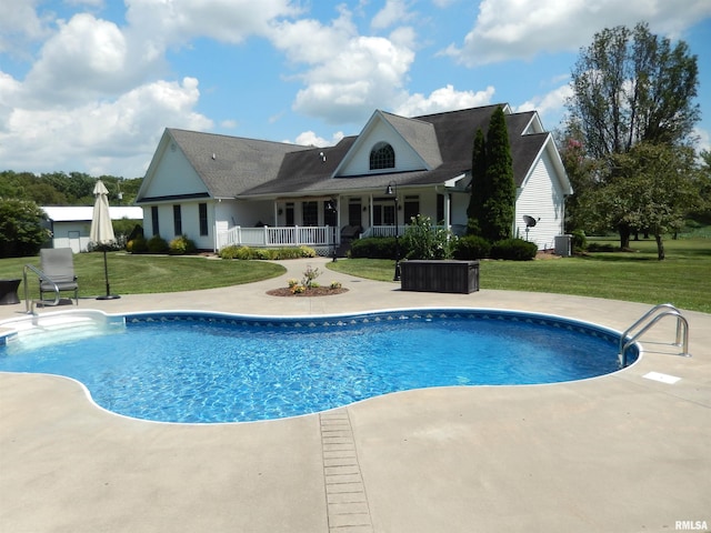 view of pool with a lawn and central AC