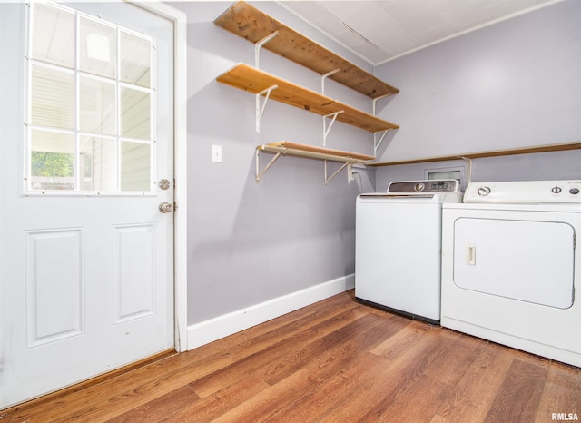 laundry area with hardwood / wood-style flooring and separate washer and dryer