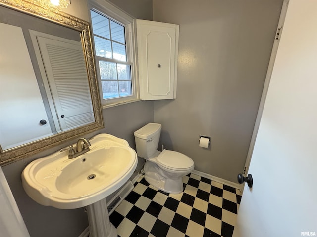 bathroom with toilet and sink