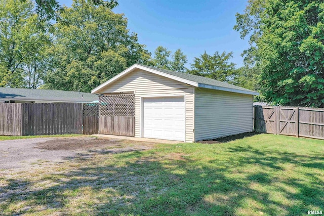 garage with a lawn