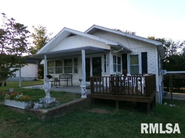 318 Williams St, Rosiclare, IL 62982 - view of front of property with a front yard and a deck