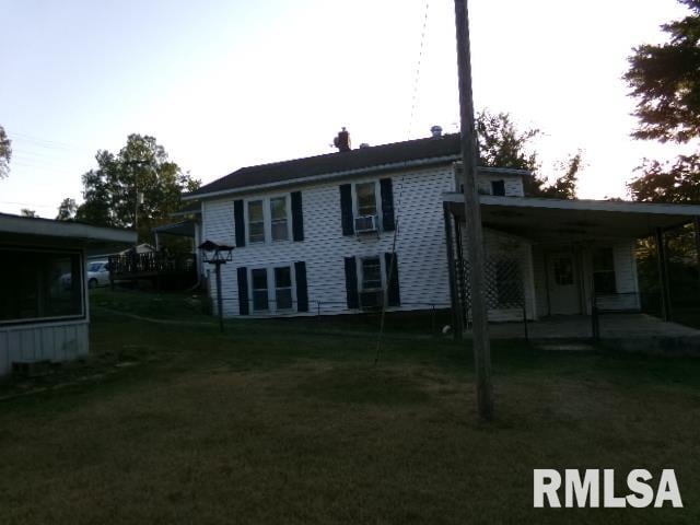 318 Williams St, Rosiclare, IL 62982 - rear view of property featuring a lawn