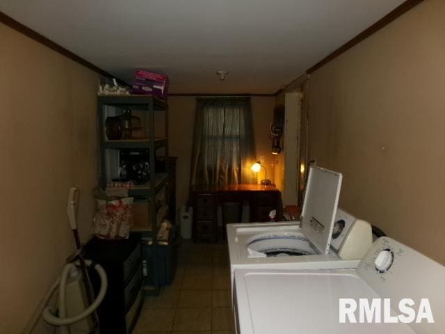 318 Williams St, Rosiclare, IL 62982 - clothes washing area featuring washing machine and clothes dryer, crown molding, and tile patterned flooring