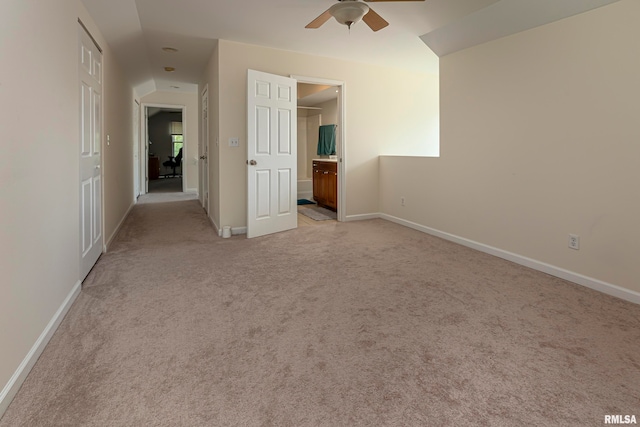 carpeted empty room featuring ceiling fan