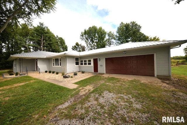 ranch-style home featuring a garage and a front yard