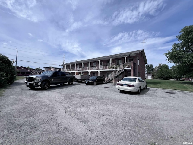 uncovered parking lot featuring stairs