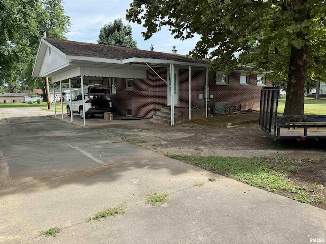 view of front of home with a carport