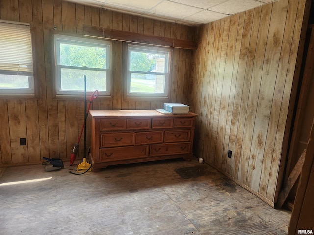 unfurnished bedroom featuring wooden walls