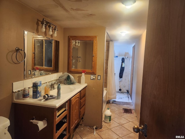 full bathroom with vanity, toilet, tile patterned floors, and shower / bath combination with curtain