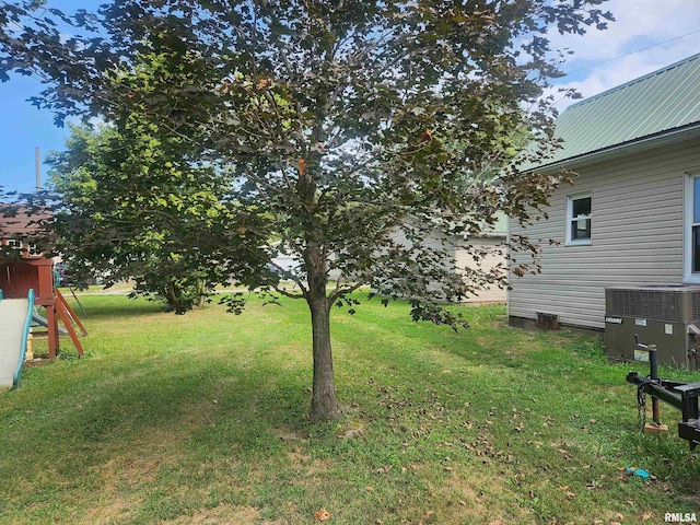 view of yard featuring central air condition unit