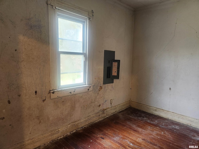 unfurnished room featuring hardwood / wood-style floors and electric panel