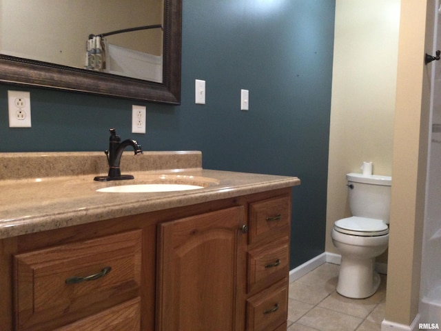 bathroom with tile patterned floors, toilet, and vanity