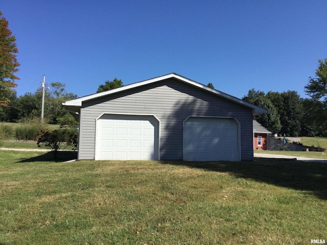 garage with a lawn