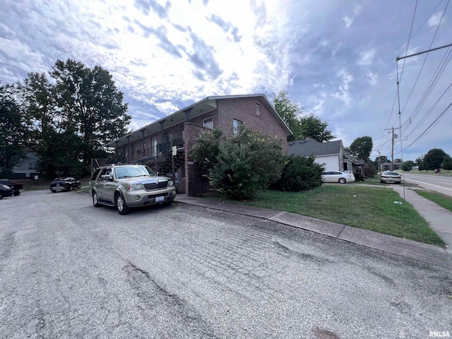 view of property exterior featuring a yard