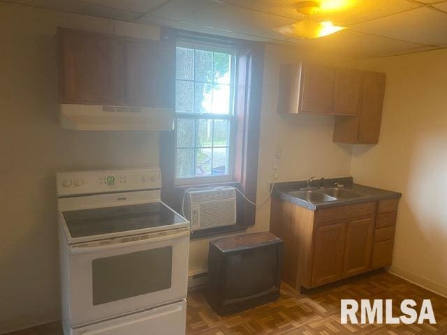 kitchen featuring sink, white electric stove, parquet flooring, a drop ceiling, and exhaust hood