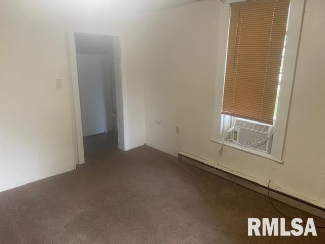 1808 Pine St, Murphysboro, IL 62966 - spare room featuring cooling unit, carpet, and a baseboard radiator