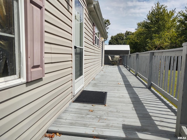 view of home's exterior featuring a wooden deck