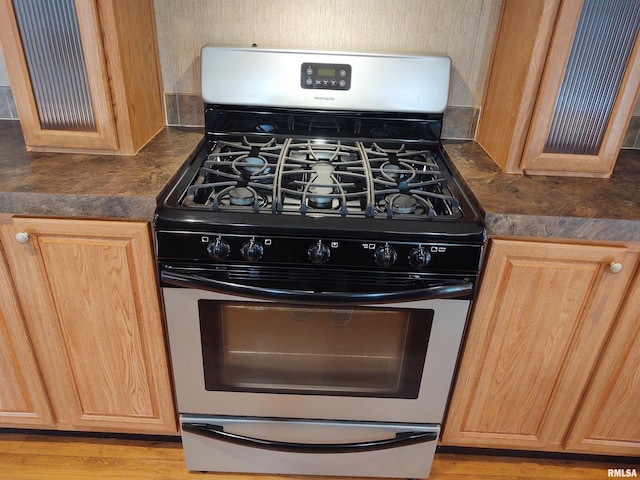 kitchen featuring stainless steel range with gas cooktop and light hardwood / wood-style floors