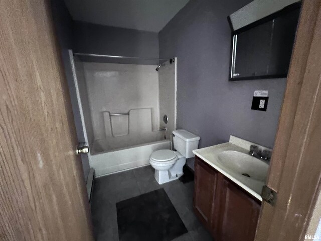 bathroom featuring toilet, vanity, tile patterned floors, and  shower combination