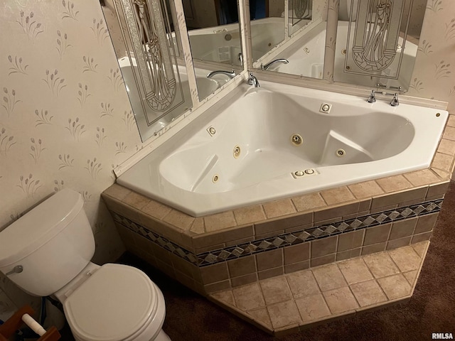 bathroom featuring toilet and tiled tub