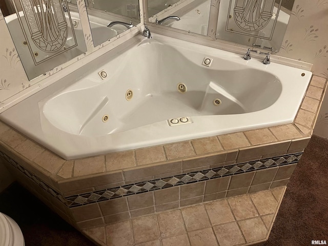 bathroom featuring tiled tub