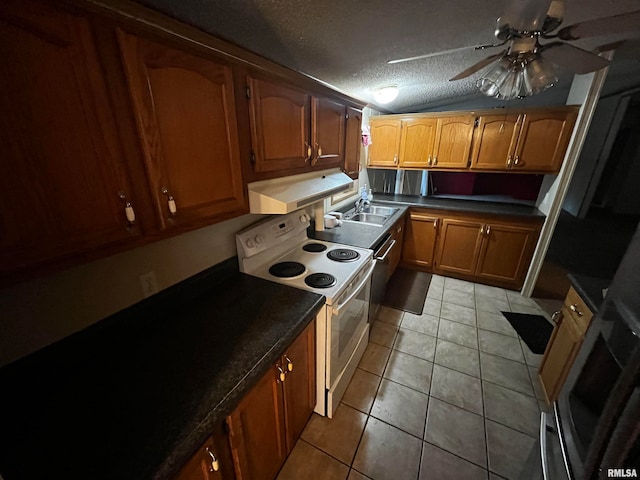 kitchen with a textured ceiling, vaulted ceiling, light tile patterned floors, ceiling fan, and electric stove