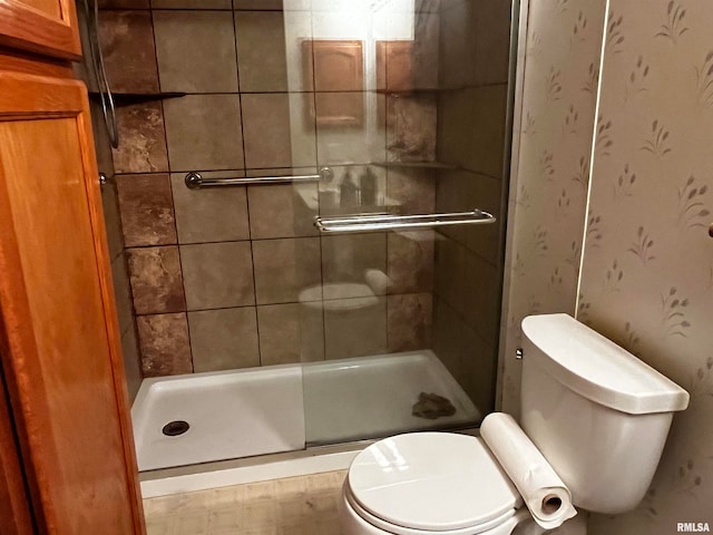 bathroom with toilet and walk in shower