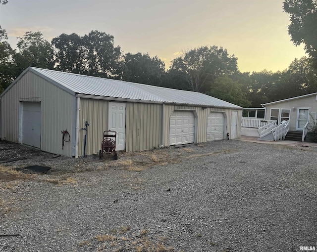 outdoor structure at dusk with a garage