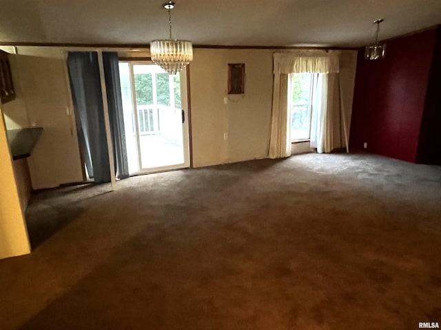 interior space with carpet, a notable chandelier, and a healthy amount of sunlight