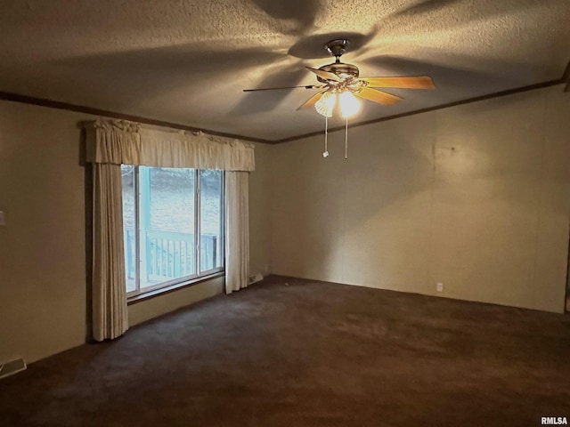 carpeted spare room featuring crown molding, a textured ceiling, and ceiling fan