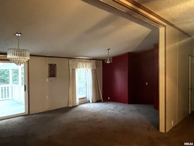 carpeted spare room with a notable chandelier and a healthy amount of sunlight