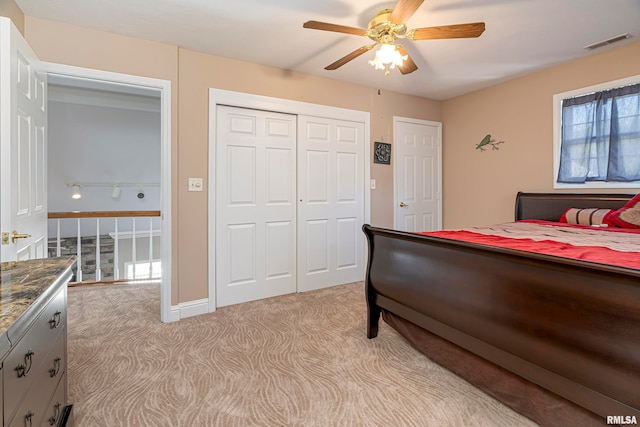 bedroom featuring light colored carpet and ceiling fan