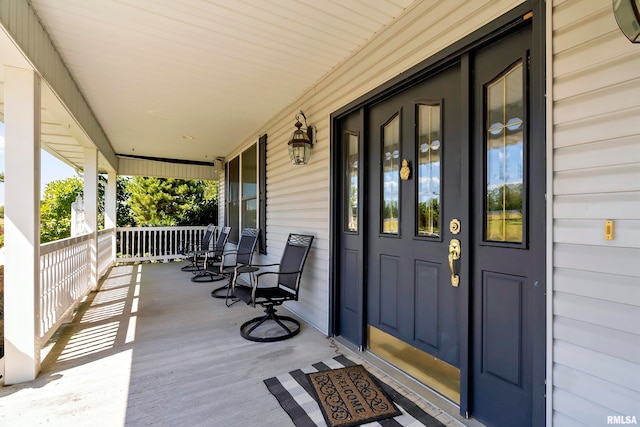 doorway to property featuring a porch