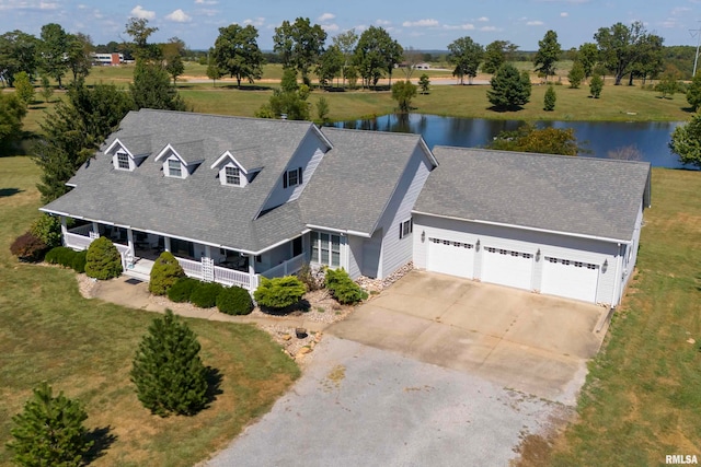 birds eye view of property with a water view