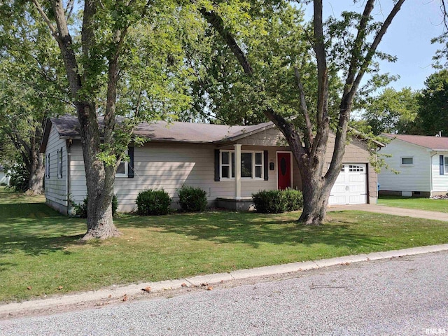 ranch-style house featuring a garage and a front lawn