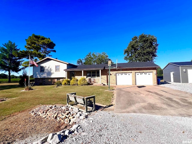 view of front of property featuring a garage and a front yard